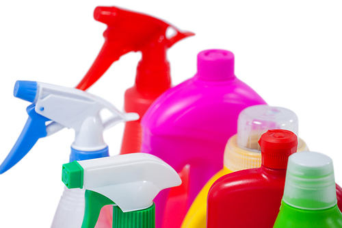 Various detergent bottles and containers arranged on white background