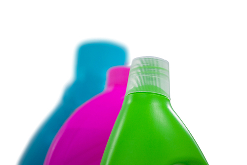 Various detergent containers arranged on white background