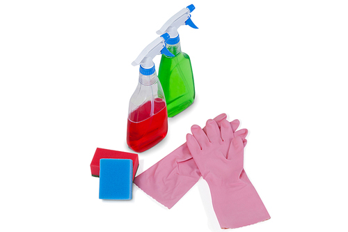Detergent spray bottles, sponge pad and rubber glove arranged on white background