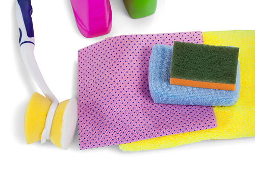 Detergent containers, scouring pad, towel, napkin cloth and cleaning brush arranged on white background