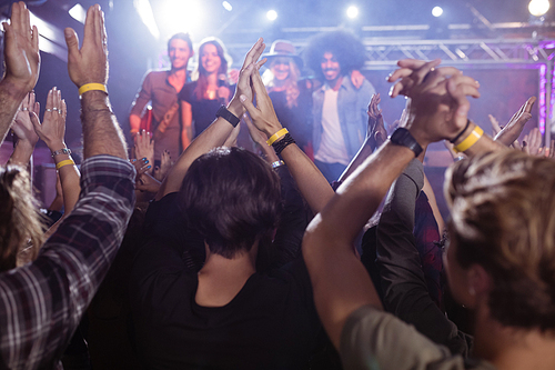 Crowd enjoying at nightclub during music festival