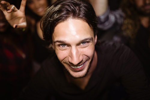 High angle portrait of smiling man at nightclub