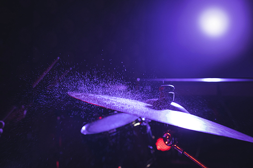 Close up of drum set in illuminated nightclub