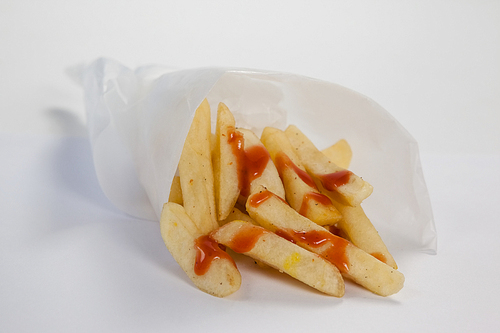 Close-up of french fried chips on table