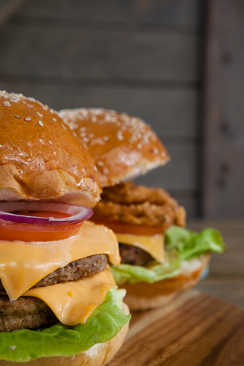 Close-up of hamburgers on chopping board