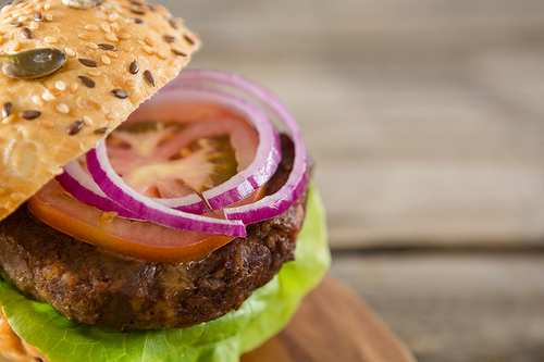 Cropped image of burger on cutting board