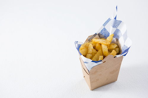 High angel view of French fries in carton box on table