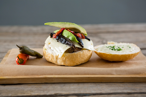 Close up of ingredients with buns on cutting board