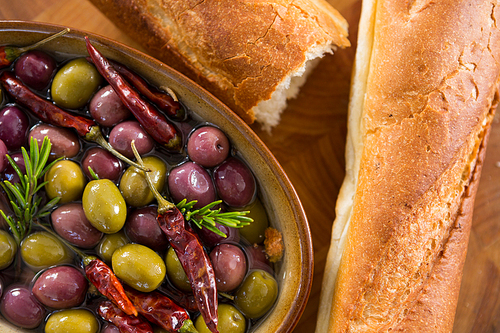 Close-up of pickled olives with bread