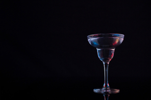 Close-up of cocktail martini on table against black background