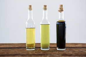 Close-up of olive oil and balsamic vinegar in bottle on table