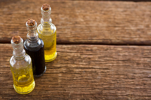 Close-up of olive oil and balsamic vinegar in bottle on table