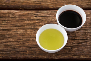 Close-up of olive oil and balsamic vinegar in bowl on table