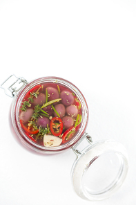 Preservative olives in jar against white background