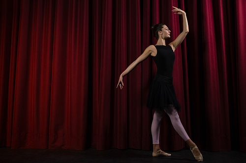 ballerina performing dance dance on stage in theatre