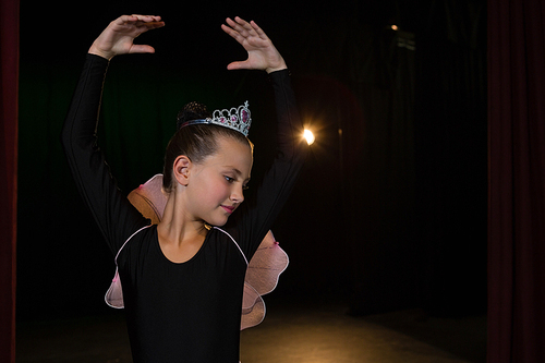 Ballerina practicing ballet dance in the stage