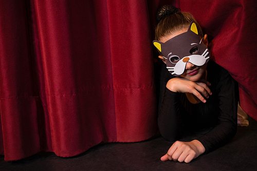 dance dancer wearing mask gesturing on the stage