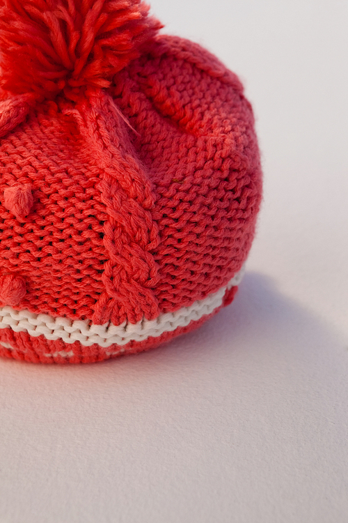 Close-up of wooly hat on white background