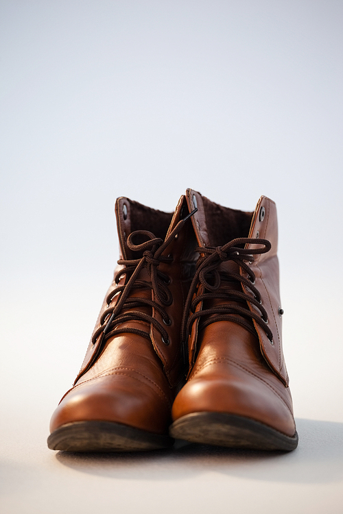 Close-up of shoes pair against white background