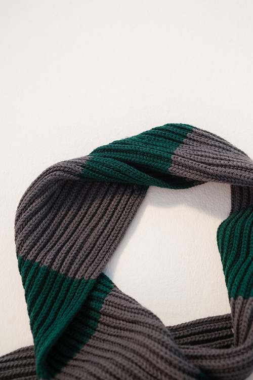 Close-up of wooly scarf on white background