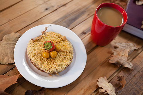 Close-up of breakfast and coffee with autumn leaves