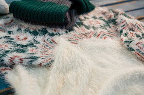 Close up of warm clothes on table