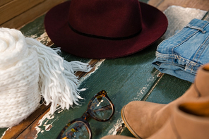 Close up of personal accessories on wooden table
