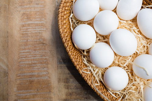 Close-up of fresh eggs in wicker basket