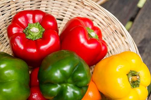 Close-up of fresh bell peppers in wicker basket