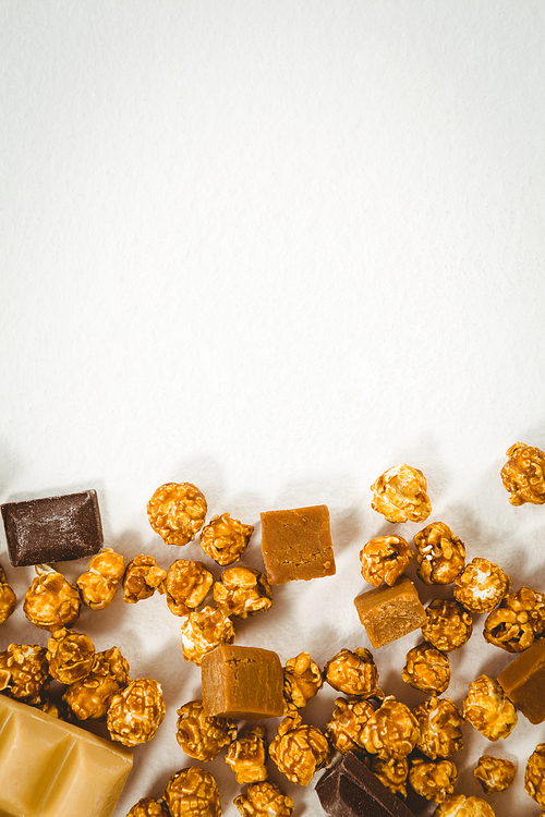 Overhead view of chocolates on white background