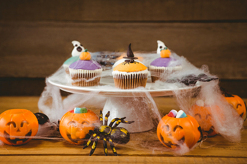 Close up of sweet food on wooden table during Halloween