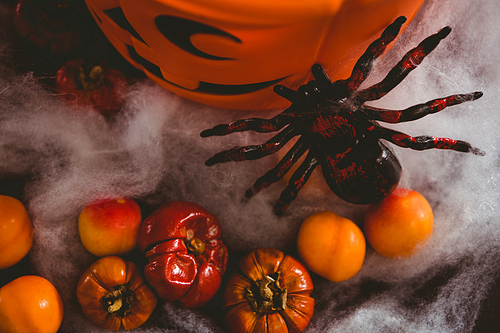 High angle view of food and decoration by bucket over black background