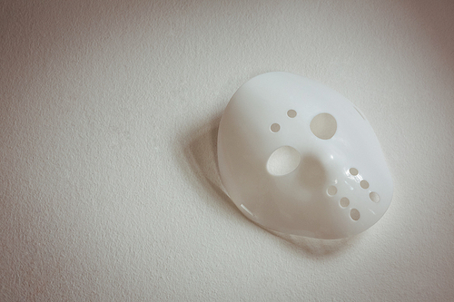 High angle view of face mask over white background