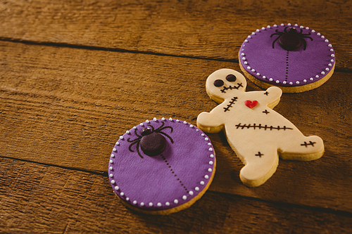 High angle view of Halloween cookies on wooden table