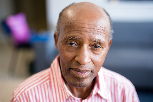 Portrait of senior man with receding hairline at nursing home