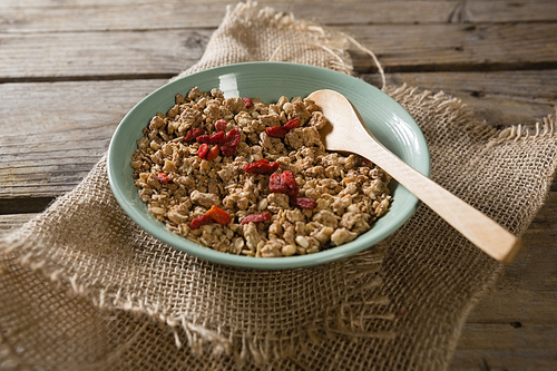 Bowl of oatmeals on wooden table