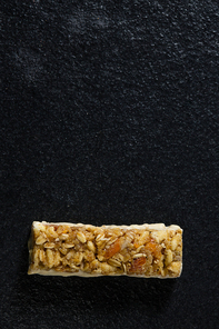 Close-up of granola bar on black background