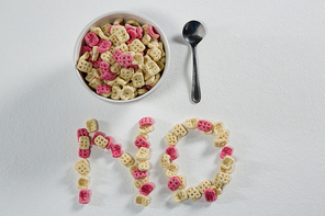 Honeycomb cereal arranged text no with bowl and spoon on white background