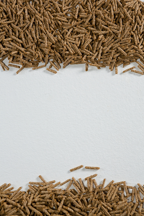 Overhead of cereal bran sticks on white background