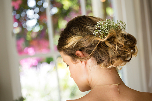 Close up rear view of bride hair with flowers