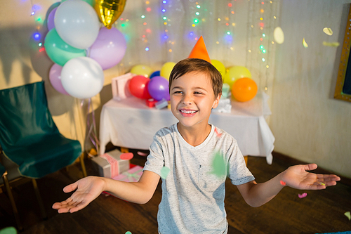 Happy boy enjoying during birthday party at home