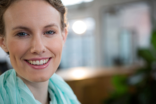 Portrait of a beautiful woman smiling in office
