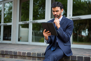 Businessman using digital tablet in conference centre