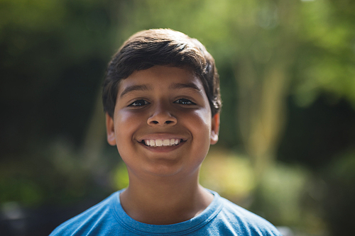Portrait of smiling boy at park