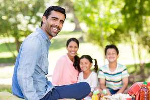 Happy family enjoying together in park on a sunny day