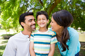 Happy family enjoying together in park