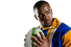 Close up of aggressive rugby player looking away while playing against white background