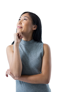 Thoughtful woman standing against white background