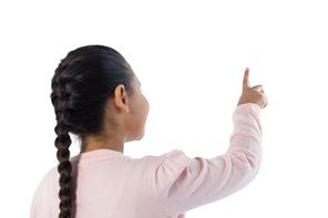 Girl pretending to touch an invisible screen against white background