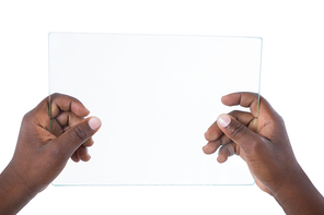 Hand holding a glass digital tablet against white background